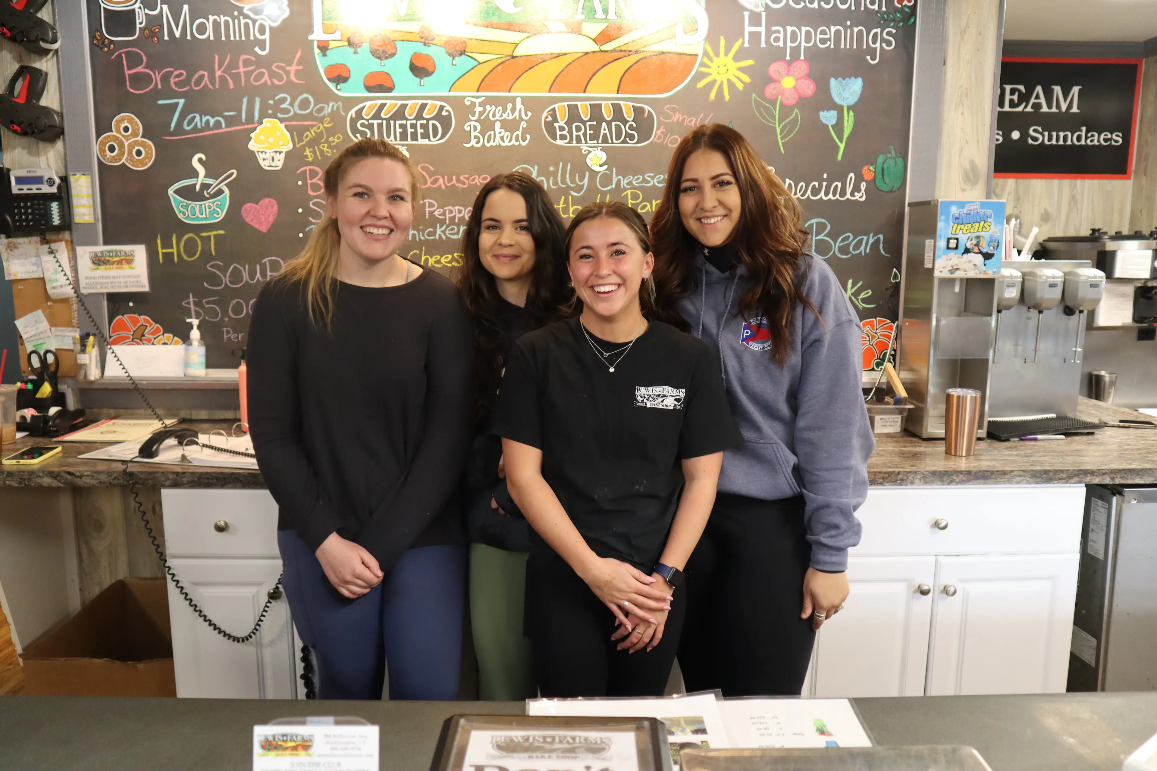 A few smiling staff members at Lewis Farms